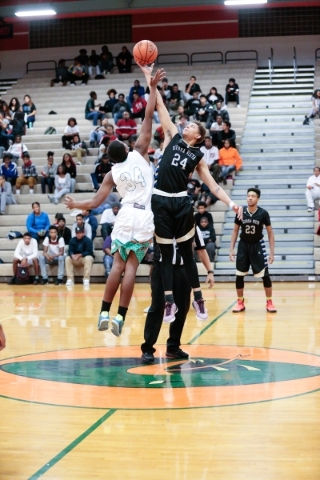 Mojave junior Markaule Pace (34) is beaten to the ball by Sierra Vista Junior Jasper Cook (2 ...