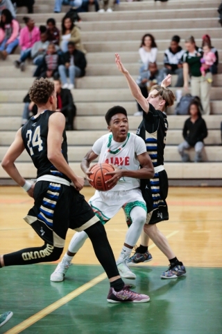 Mojave freshman J.D. McCormick (31), center, attempts to get around Sierra Vista junior Jasp ...