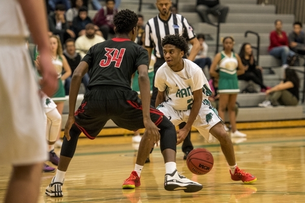 Keith Davis (2) of the Rancho Rams is defended by Marquise Raybon (34) of the Las Vegas Wild ...