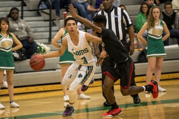 Chris Jackson (3) of the Rancho Rams is defended by Deondre Northey (5) of the Las Vegas Wil ...