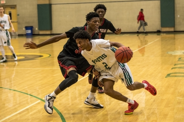 Keith Davis (2) of the Rancho Rams pushes past Marquise Rayon (34) of the Las Vegas Wildcats ...