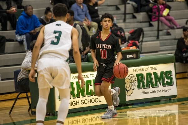 Josh Valencia (10) of the Las Vegas Wildcats moves with the ball while being defended by Chr ...