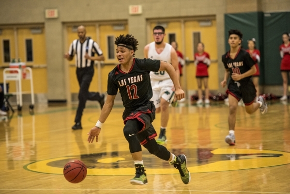 Donovan Joyner (12) of the Las Vegas Wildcats runs with the ball against the Rancho Rams dur ...