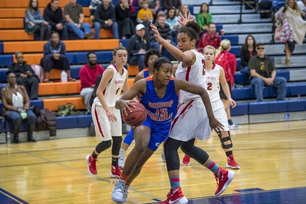 Madison Washington (15) of the Bishop Gorman Lady Gaels drives to the basket against the Cas ...