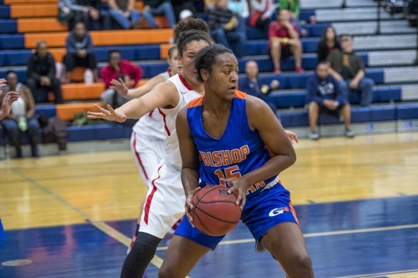 Madison Washington (15) of the Bishop Gorman Lady Gaels holds the ball against the Castle Vi ...