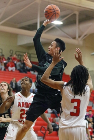 Palo Verde‘­s Taylor Miller, center, goes for a layup between Arbor View‘s Jarrod Bu ...