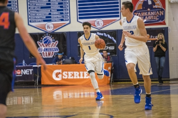 Bishop Gorman guard Chase Nomaaea (1) moves with the ball against Timpview (Utah) during the ...