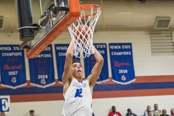 Bishop Gorman center Zach Collins (12) dunks the ball against Timpview (Utah) during the fir ...