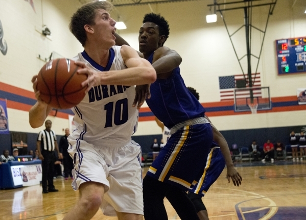 Durango High School‘s Jason Landman (10) attempts to work the ball around Lynwood High ...