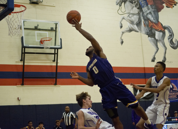 Lynwood High School‘s Jamal Bogan (0) works the ball over Durango High School‘s ...