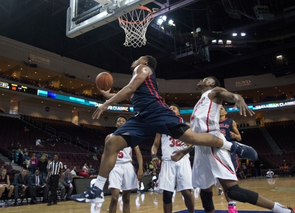 Findlay Prep‘s Carlos Johnson (3) takes the ball to the net during the fourth annual T ...