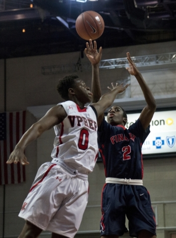 Findlay Prep‘s Shakwon Barrett (2) takes a shot at the net as Victory Prep‘s Ant ...