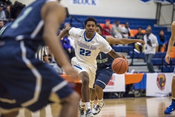 Bishop Gorman guard Christian Popoola Jr. (22) drives to the net against Overland, Colo., du ...