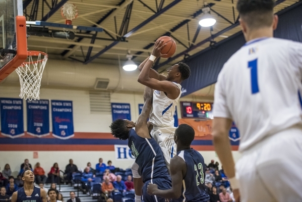 Bishop Gorman guard Chuck O‘cannon (5) takes a shot against Overland, Colo., during th ...