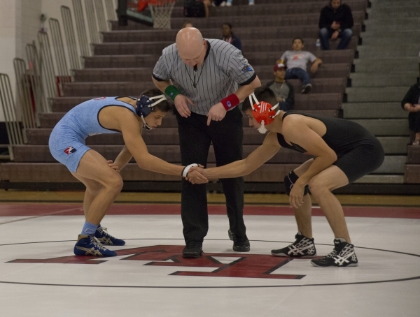 Centennial‘s Nico Antuna, left, shakes hands with Chaparral‘s Julio Bravo during ...