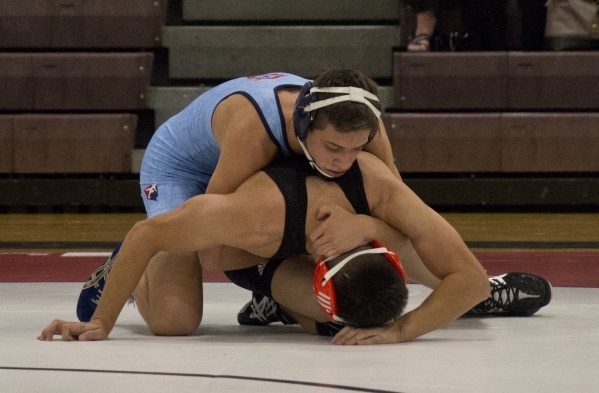 Centennial‘s Nico Antuna, top, wrestles Chaparral‘s Julio Bravo during a quad me ...