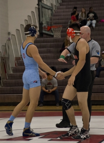 Centennial‘s Nico Antuna, left, shakes hands with Chaparral‘s Julio Bravo during ...