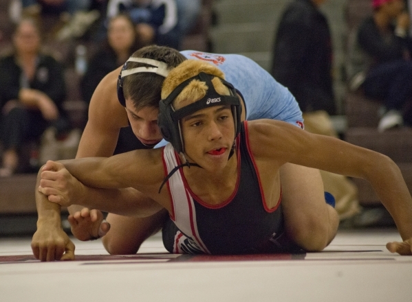 Centennial‘s Nico Antuna, top, wrestles Las Vegas‘ Aaron Najera during a quad me ...