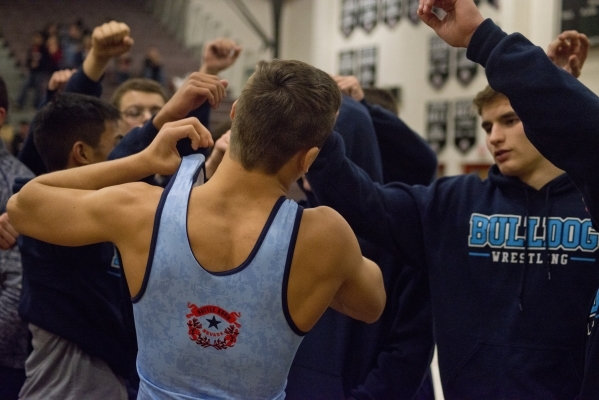 Centennial‘s Nico Antuna, center, is encouraged by his teammates before going out onto ...