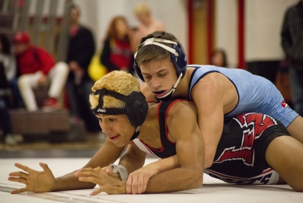 Centennial‘s Nico Antuna, top, wrestles Las Vegas‘ Aaron Najera during a quad me ...