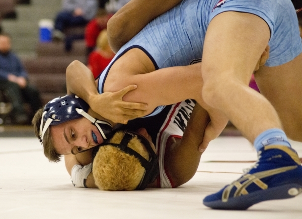 Centennial‘s Nico Antuna, top, wrestles Las Vegas‘ Aaron Najera during a quad me ...