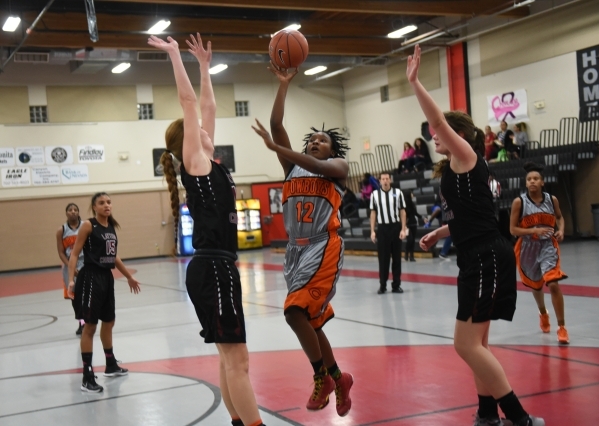 Chaparral‘s Shanice Aycox (12) shoots the ball against Utah‘s Layton Christian d ...