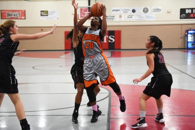 Chaparral‘s Marcia Hawkins (20) goes up for a shot against Utah‘s Layton Christi ...