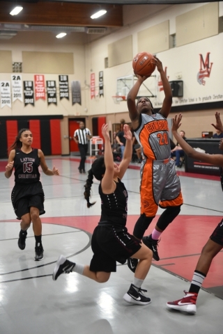 Chaparral‘s Marcia Hawkins (20) goes up for a shot against Utah‘s Layton Christi ...