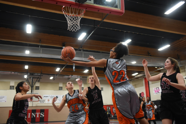 Chaparral‘s Jade Hazelton (22) goes up for a shot against Utah‘s Layton Christia ...