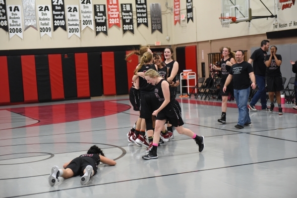 Utah‘s Layton Christian girls basketball team celebrate after defeating Chaparral duri ...