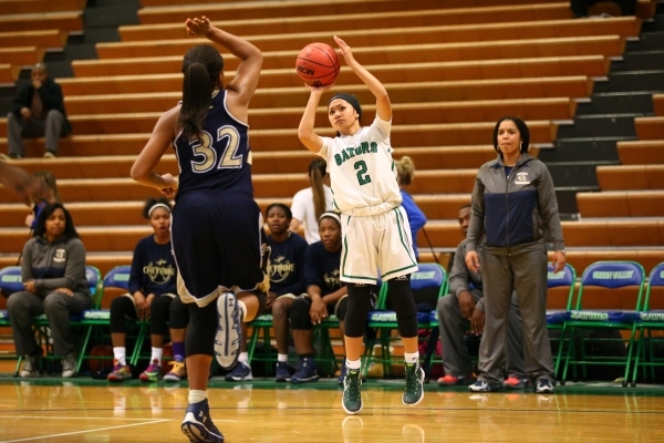 Green Valley‘s Gwen Garcia (2) looks to shoot over Cheyenne‘s Da‘Vione Lom ...