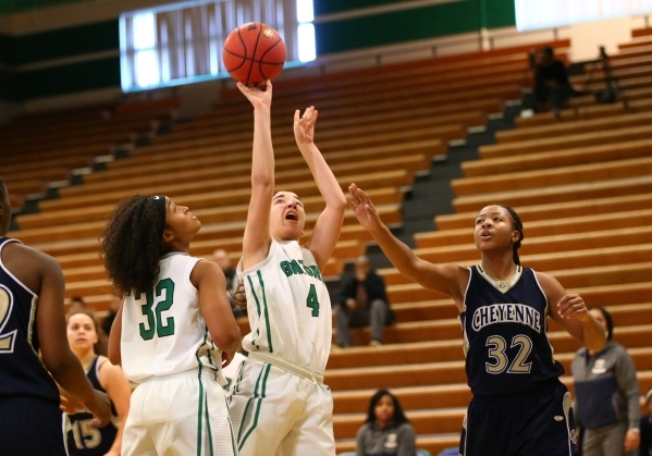 Green Valley‘s Ellee Barton (4) shoots against Cheyenne as Green Valley‘s Yamile ...