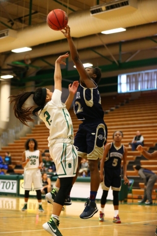 Cheyenne‘s Morrisha Harden (12) blocks a shot from Green Valley‘s Gwen Garcia (2 ...