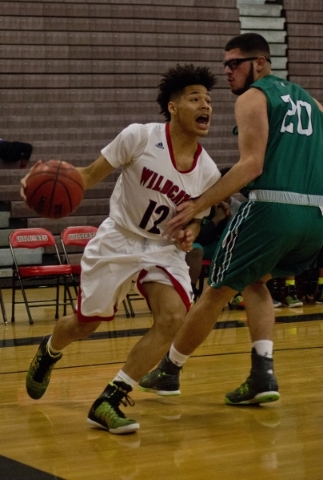 Las Vegas‘ Donovan Joyner (12) works the ball around Rancho‘s Michael Hernandez ...