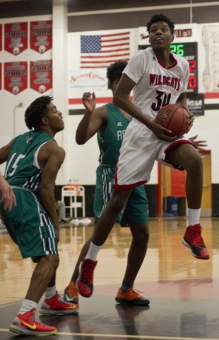 Las Vegas‘ Marquise Raybon (34) takes the ball to the net during their game against La ...