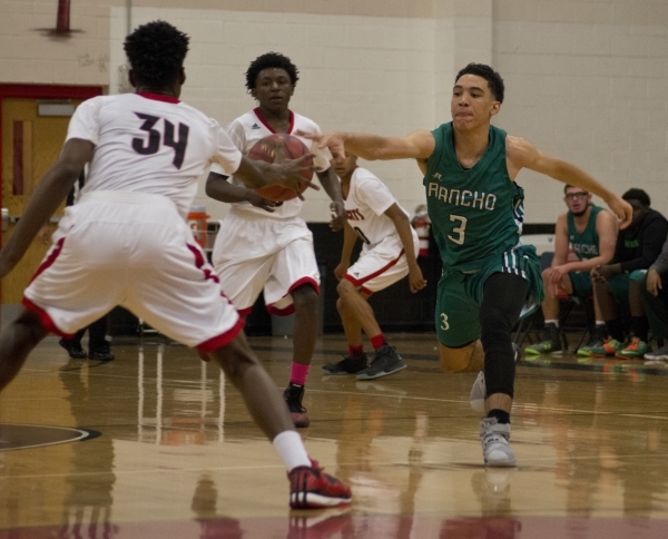 Rancho‘s Chrys Jackson (3) and Las Vegas‘ Marquise Raybon (34) reach for the bal ...