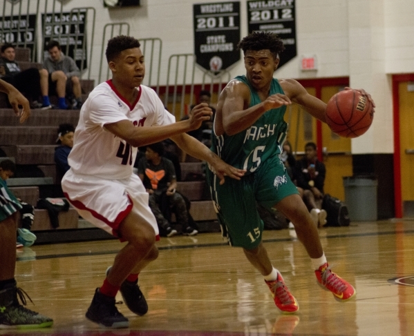 Rancho‘s Dion Southern (15) works the ball around Las Vegas‘ Zion Edward (40) du ...