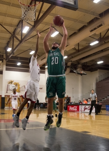 Rancho‘s Michael Hernandez (20) takes the ball to the net as Las Vegas‘ Zach Mat ...