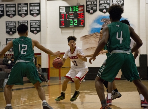 Las Vegas‘ Donovan Joyner (12) works the ball up the court during their game against ...