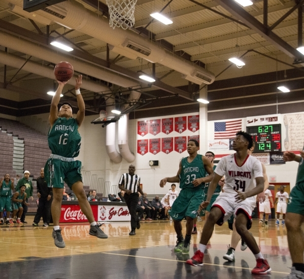 Rancho‘s Chris Estrella (12) takes the ball to the net during their game against Las V ...