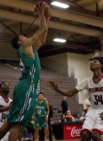 Rancho‘s Lamont Traylor (33) takes the ball to the net during their game against Las V ...