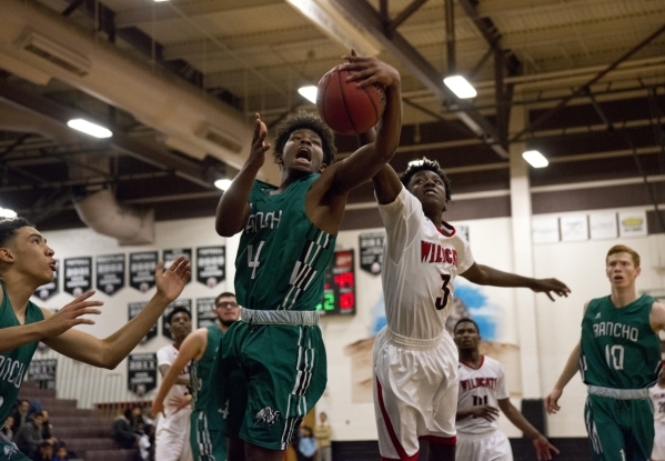 Rancho‘s Stepfon Cotton-Taylor (4) and Las Vegas‘ Ronald Daniels (3) battle for ...