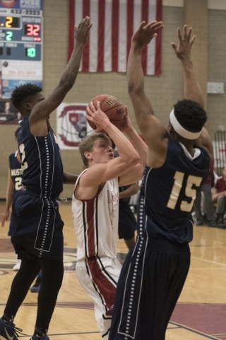 Jacob Heese (32) of Desert Oasis prepares to shoot against Shadow Ridge‘s Vernon Swins ...