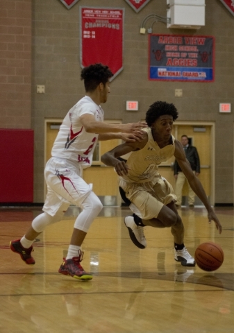 Shadow Ridge‘­s Jerell Springer (0) drives against Arbor View‘­s Rashaad Thoma ...