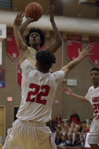 Shadow Ridge‘­s Jerell Springer (0) shoots over Arbor View‘­s Rashaad Thomas ( ...