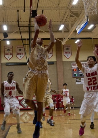 Shadow Ridge‘­s Nick Blake (24) takes the ball to the net during their game at Arbor ...