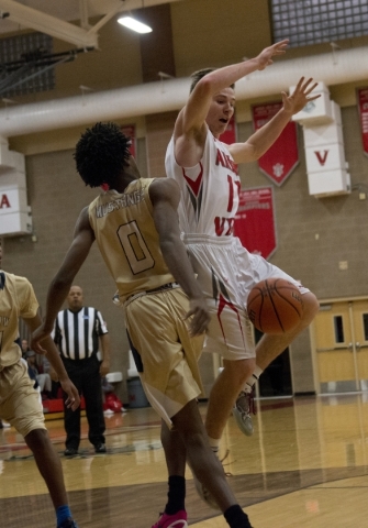 Arbor View‘s Jesse Vogel (11) loses the ball after Shadow Ridge‘s Jerell Springe ...