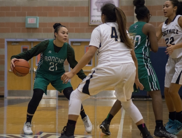 Rancho‘s Tatianna Lee (21) looks to get the ball past FoothillÃ­s Trinity Betoney (4 ...