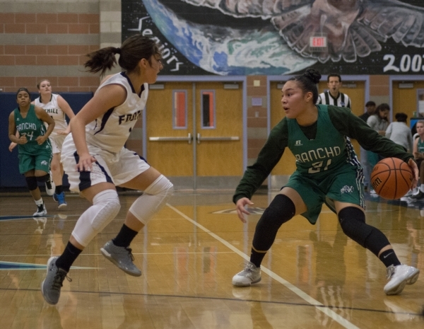 Rancho‘s Tatianna Lee (21) faces off against FoothillÃ­s Amanda Carducci (1) during ...