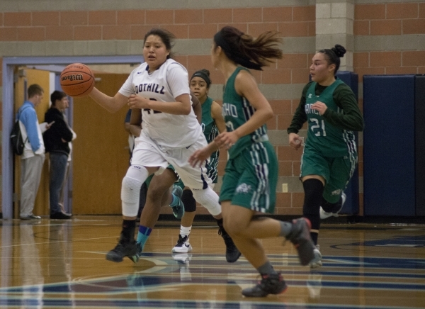 Foothill‘s Trinity Betoney (42) works the ball up the court during their home game aga ...